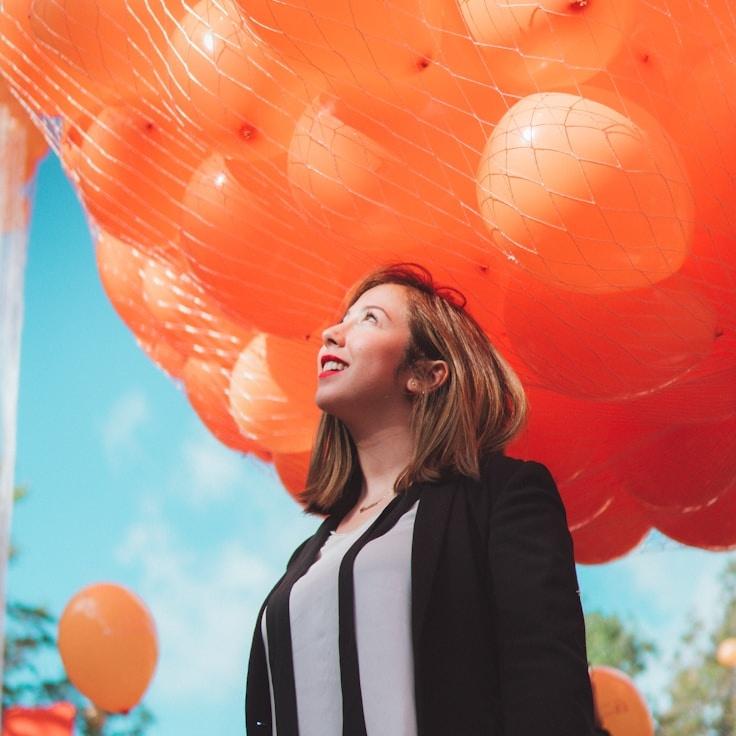 Kaveri Mehta, Lead Design Curator at Beacon Orbit Path, reviewing corporate floral arrangements